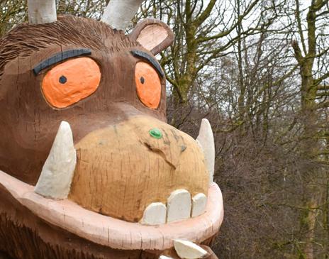 photo of the Gruffalo with a forest in the background