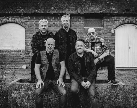 Black and white photo of the band "Guitar Heads"