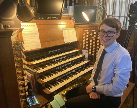 Picture of Harry Brown sitting by a organ