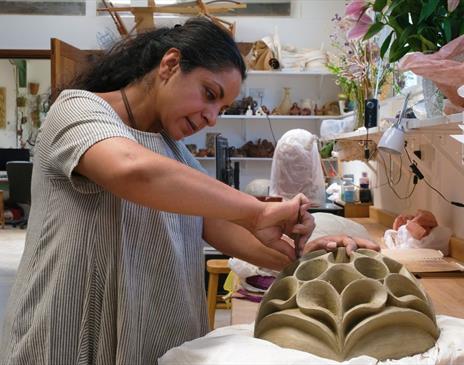 Photo of Halima Cassell Working on Exhibition Pieces at Blackwell - The Arts & Crafts House in Bowness-on-Windermere, Lake District