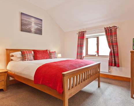 One of the double bedrooms in Hollins Cottage at Hollins Farm Holiday Park