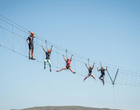 Visitors on the Infinity Bridge at Honister Slate Mine in Borrowdale, Lake District