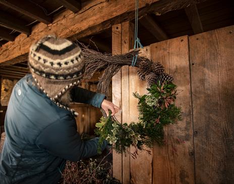 Person making a wreath