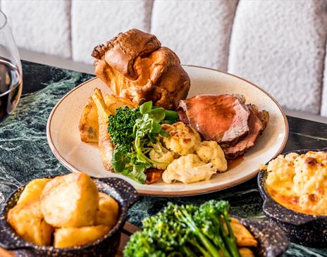 Sunday Roast with a sides of cauliflower cheese and vegetables
