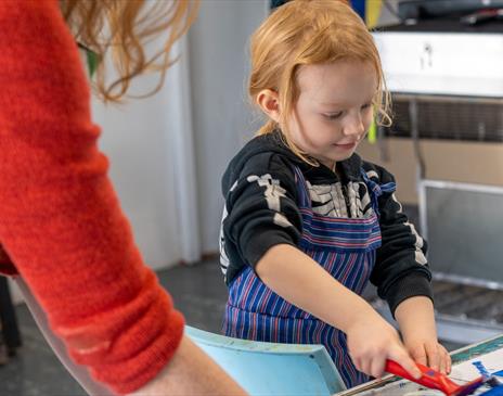Photo of a child crafting in a classroom