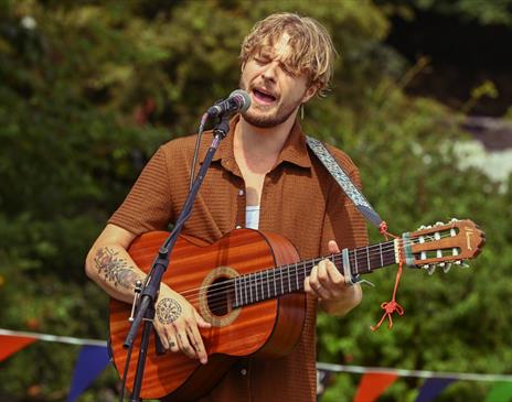 Performer singing at an event held by BarrowFull in Barrow-in-Furness, Cumbria