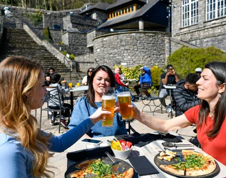 Visitors Enjoying Outdoor Dining at Brewery Arts Centre in Kendal, Cumbria