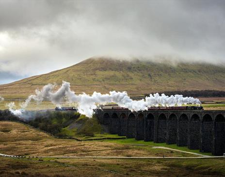 Steam Train on The Settle - Carlisle Railway line in Cumbria, UK