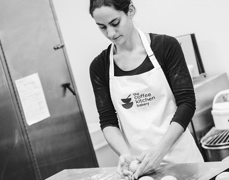 Black and White Photo of a Baker at The Coffee Kitchen Bakery in Cockermouth, Cumbria