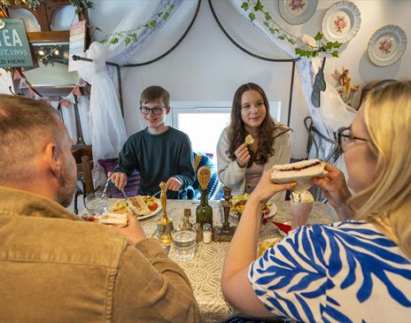 Family enjoying food and drink at The Fairydust Emporium in Silloth, Cumbria