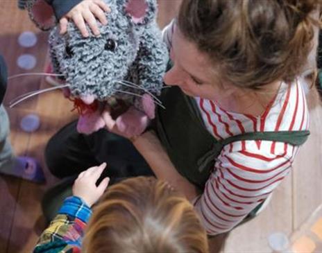 Big Days for Tiny Theatre Makers: Playtime, Theatre  a  lady carrying out a workshop with children showing a rat puppet