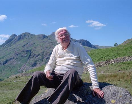 Photo of Alfred Wainwright atop a Cumbrian fell
