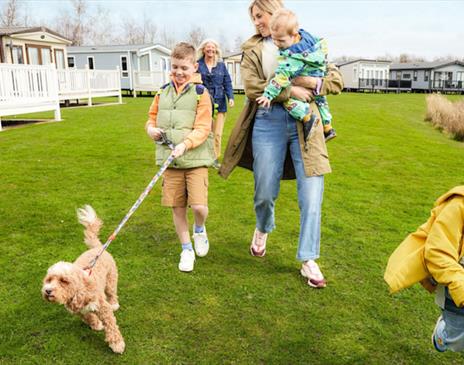 Family with dog at Lakeland Leisure Park in Flookburgh, Cumbria