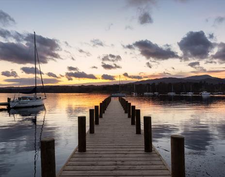View from a Jetty over Windermere with a Dramatic Sunset in the Lake District, Cumbria