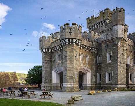 Exterior and picnic tables at Wray Castle, Low Wray, Ambleside, Lake District