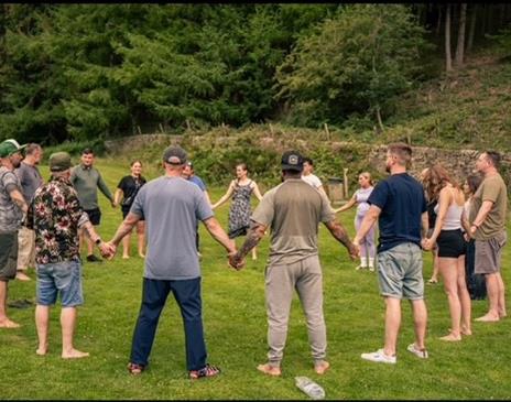 Group of people holding hands in a circle