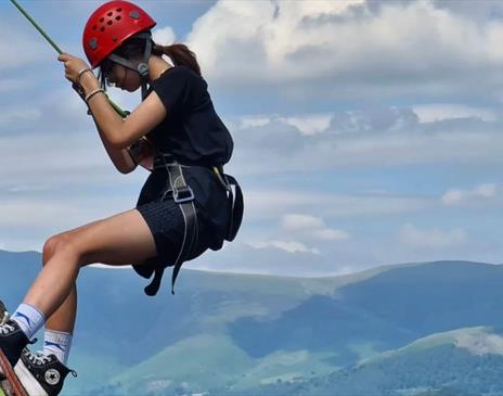 Visitor rock climbing with Newlands Adventure Centre in the Lake District, Cumbria