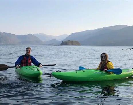 Visitors in kayaks from Newlands Adventure Centre in the Lake District, Cumbria