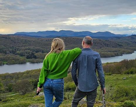 Socially Awkward stood overlooking a lake in Cumbria