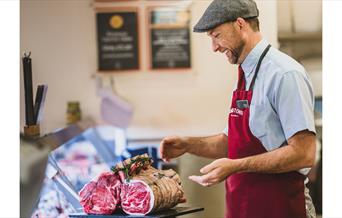 Butcher working at Cranstons in Cumbria