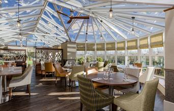 Dining Tables and Seating at The Conservatory at The Melbreak Hotel in Great Clifton, Cumbria