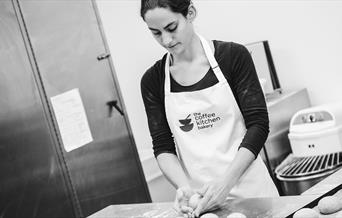 Black and White Photo of a Baker at The Coffee Kitchen Bakery in Cockermouth, Cumbria