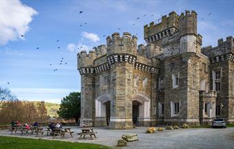 Exterior and picnic tables at Wray Castle, Low Wray, Ambleside, Lake District