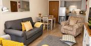Living room, kitchen, and dining area in Number 7 at Howgills Apartments in Sedbergh, Cumbria