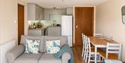 Living room, dining area, and kitchen in Number 8 at Howgills Apartments in Sedbergh, Cumbria