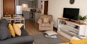 Living room, kitchen, and dining area in Number 7 at Howgills Apartments in Sedbergh, Cumbria