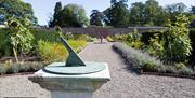 The Walled Garden at Netherby Hall in Longtown, Cumbria, with a Sundial in the Foreground