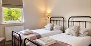 Bedroom 1 with two twin beds at Howgills House near Sedbergh, Cumbria