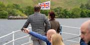 Visitors at a Corporate Event aboard Ullswater 'Steamer' on Ullswater in the Lake District, Cumbria