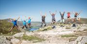 Climbers Jumping After Completing Via Ferrata Xtreme at Honister Slate Mine in Borrowdale, Lake District