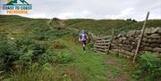 Visitor on a Running Holiday with Coast to Coast Packhorse in the Lake District, Cumbria