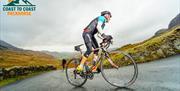 Visitor on a Cycling Holiday with Coast to Coast Packhorse in the Lake District, Cumbria