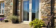 Exterior and outside seating in Number 8 at Howgills Apartments in Sedbergh, Cumbria