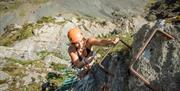Climber at Via Ferrata Xtreme at Honister Slate Mine in Borrowdale, Lake District