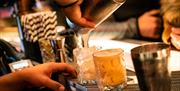 Bartender mixing drinks at BAHA in Bowness-on-Windermere, Lake District