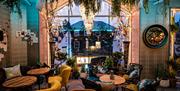 Colourful seating and decor inside BAHA in Bowness-on-Windermere, Lake District