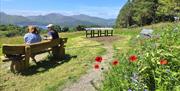 Visitors relaxing and taking in the scenery near Castlerigg Hall Caravan & Camping Park near Keswick, Lake District