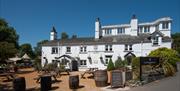 Exterior and outdoor seating at The Wateredge Inn in Ambleside, Lake District