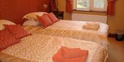 Terracotta Bedroom with Twin Beds at Bawd Hall in Keswick, Lake District