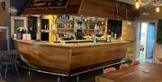 Nautical themed bar shaped like a ship's stern at Captain Nelson Tavern in Maryport, Cumbria