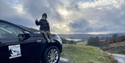Child on the Hood of the Car and a Scenic Background with 4x4 Lake Tours in the Lake District, Cumbria