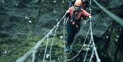 Climbers on Via Ferrata Xtreme in the Snow at Honister Slate Mine in Borrowdale, Lake District