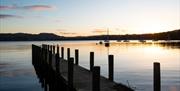 Jetty and sunset near The Wateredge Inn in Ambleside, Lake District