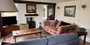 Lounge Seating and Wood Burner at The Old Barn & The Farm House in Keswick, Lake District