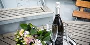 Prosecco and bouquet aboard an Ullswater 'Steamer' in the Lake District, Cumbria © Phil Green