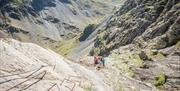 Climbers at Via Ferrata Xtreme at Honister Slate Mine in Borrowdale, Lake District